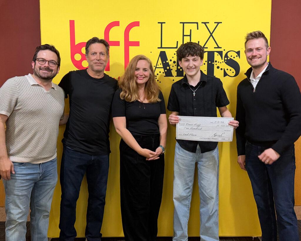 people posing with check
